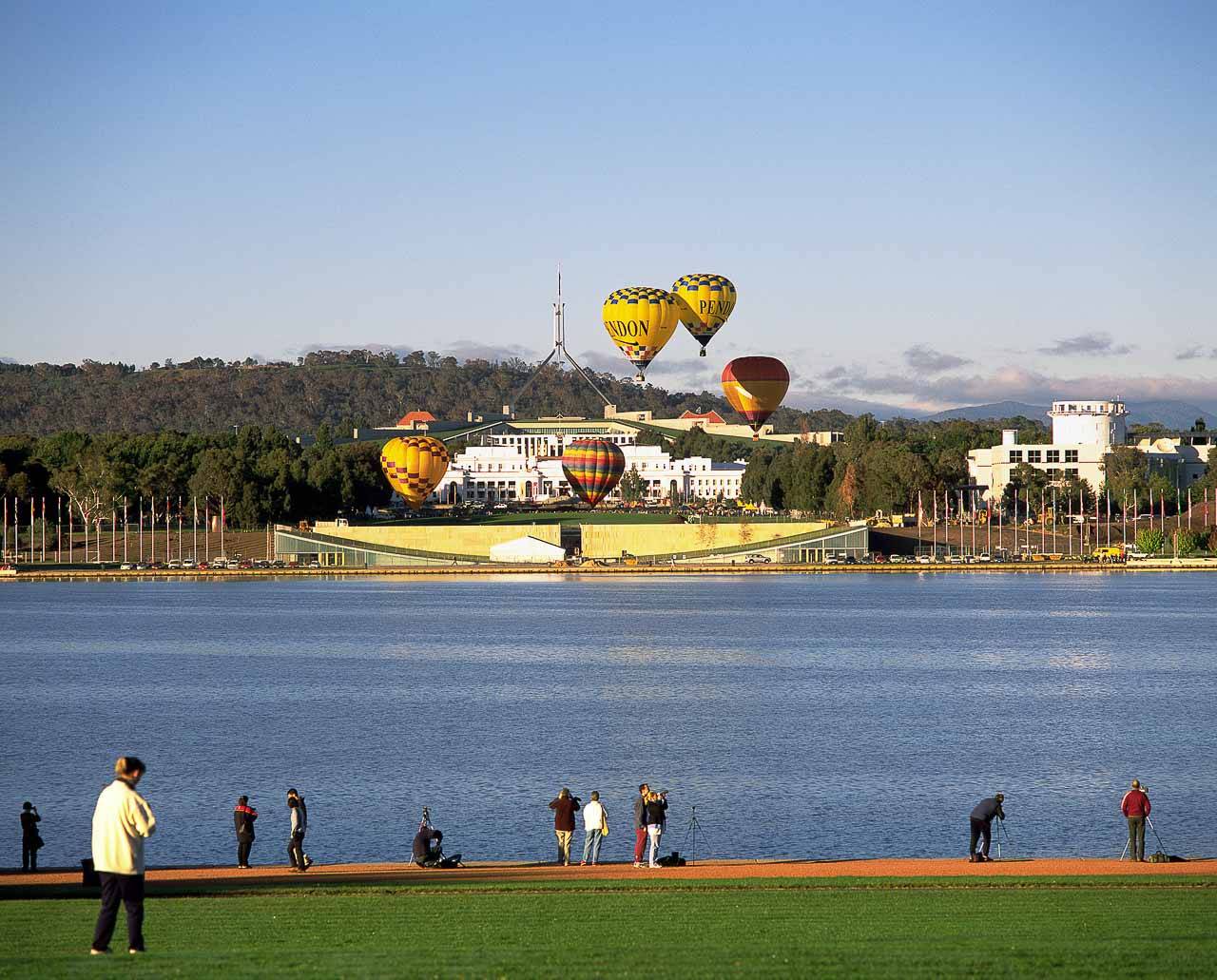 Hire Bus Canberra People next to Lake Burley Griffin in Canberra.